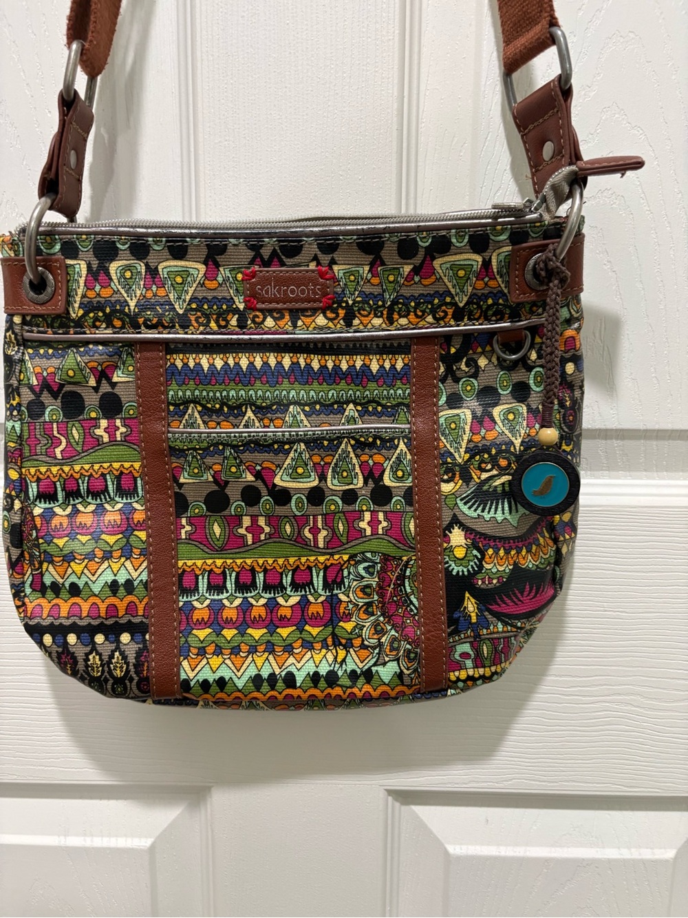 Sakroots Multicolor Artist Circle Print Crossbody with Brown Trim Coated Canvas